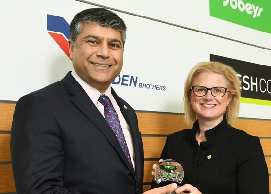 Vivek Sood and Heather Deblois receiving an award for Inclusive Leadership