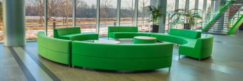 A banner image showing a green couches on the floor.