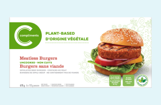 Packaging of Compliments Burgers, featuring an image of a burger with lettuce, tomato, and red onion on a sesame seed bun. Text indicates product is uncooked and non-GMO.