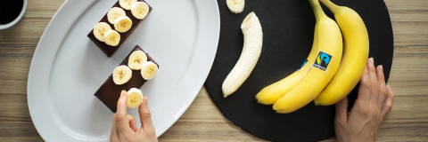 This banner image shows a person decorating pastries with bananas.